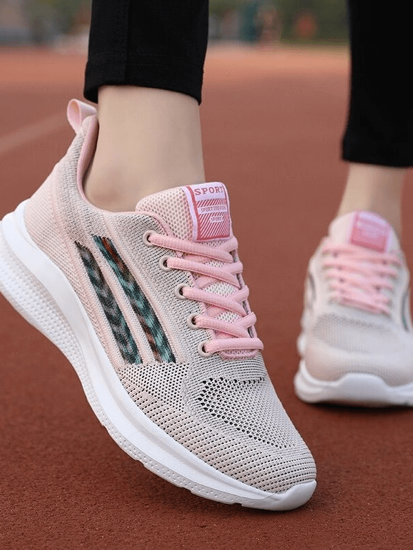 Pink Sports Mesh Breathable Women's Shoes - SF0212 on track, showing comfort and style for training. Durable and shock-absorbing design.